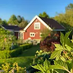 Red With Lush Gardens Near Arendal *