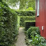 Red With Lush Gardens Near Arendal *