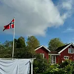 Red With Lush Gardens Near Arendal Eydehavn