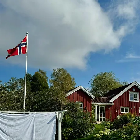 Red With Lush Gardens Near Arendal Eydehavn