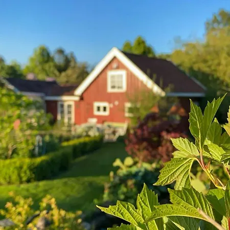 Red With Lush Gardens Near Arendal *