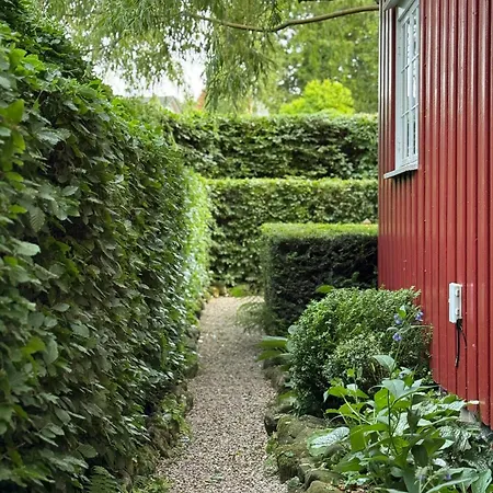 Red With Lush Gardens Near Arendal *
